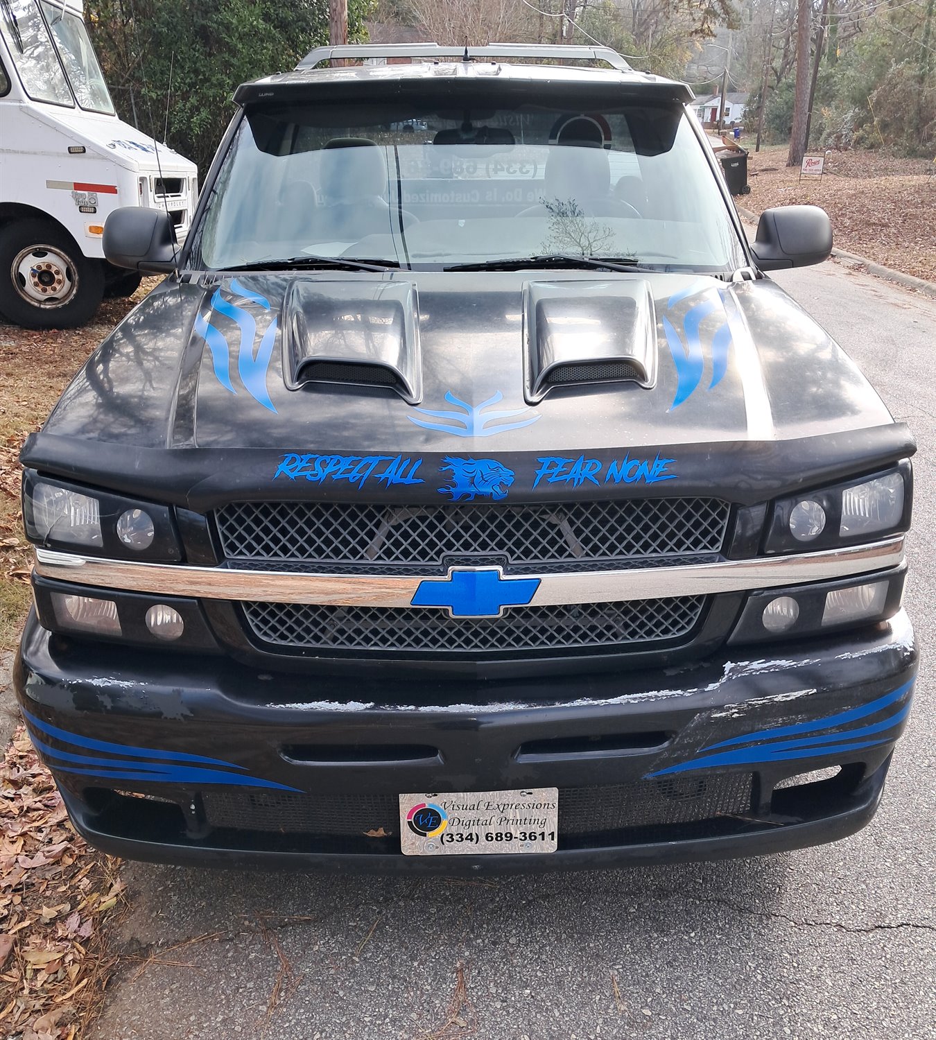 Front of the Visual Expressions Nasty truck with blue hood and bumper graphics
